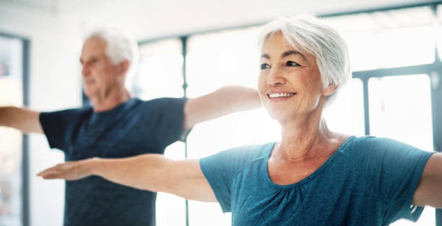 Cropped shot of a senior couple exercising together indoors